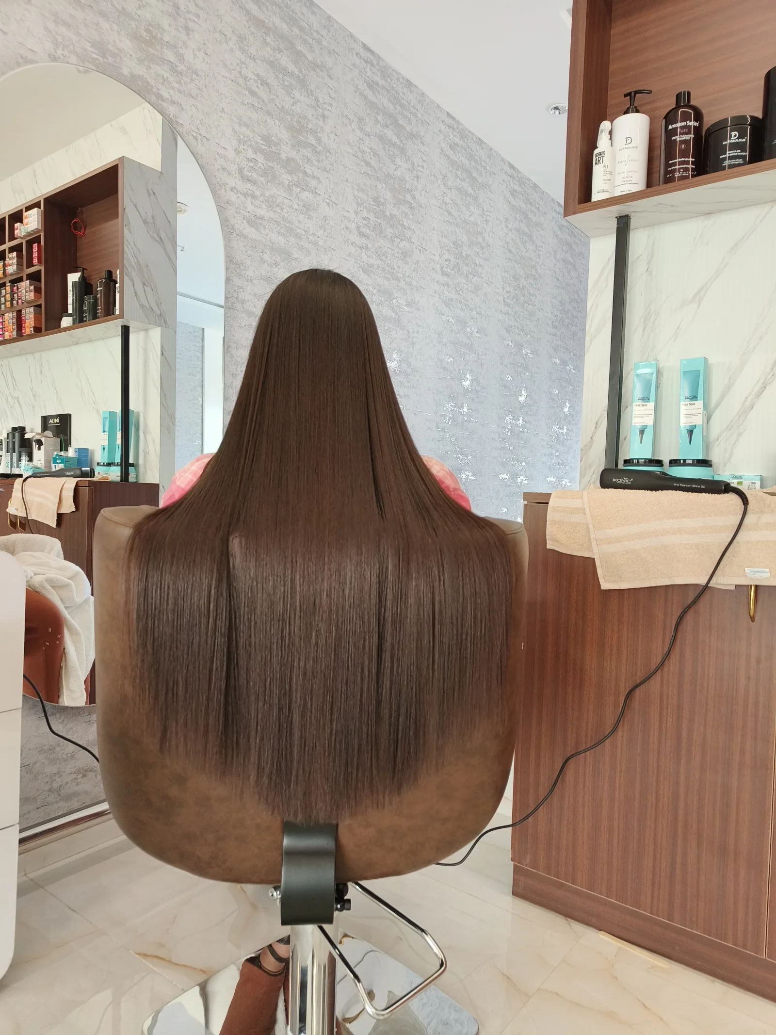 Treatment station and L'Oréal Hair Spa shelf at VOX Salon, Suchitra-Kompally